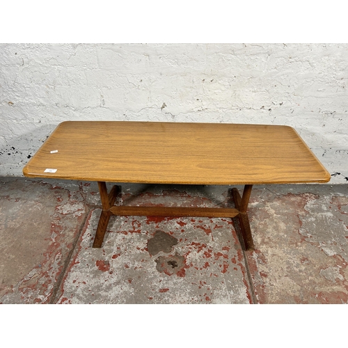 191 - A mid 20th century teak and melamine coffee table - approx. 42cm high x 46cm wide x 107cm long