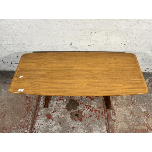 191 - A mid 20th century teak and melamine coffee table - approx. 42cm high x 46cm wide x 107cm long