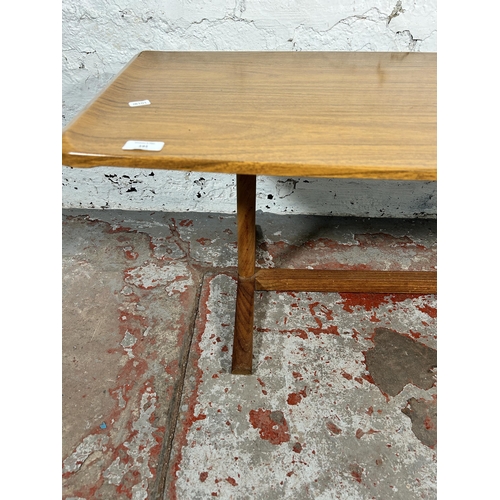 191 - A mid 20th century teak and melamine coffee table - approx. 42cm high x 46cm wide x 107cm long