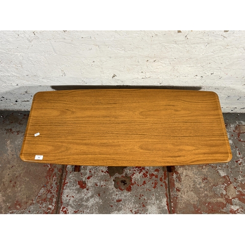 191 - A mid 20th century teak and melamine coffee table - approx. 42cm high x 46cm wide x 107cm long