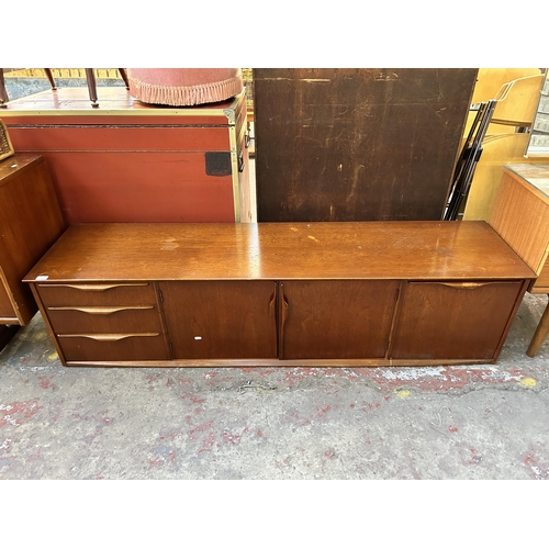 192 - A mid 20th century teak sideboard - approx. 46cm high x 183cm wide x 44cm deep