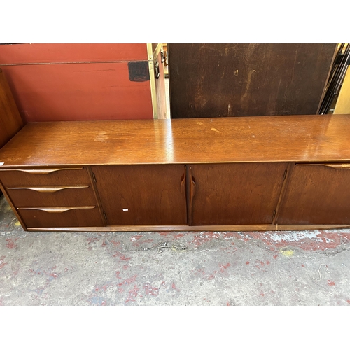 192 - A mid 20th century teak sideboard - approx. 46cm high x 183cm wide x 44cm deep