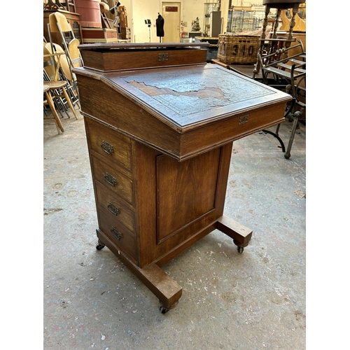 198 - A Victorian mahogany Davenport desk stamped Hobbs & Co London to brass lock - approx. 87cm high x 53... 