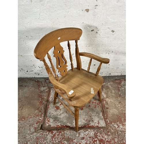 199 - A Victorian style beech farmhouse armchair