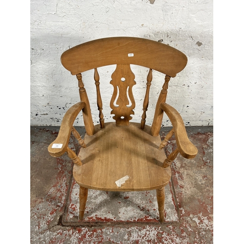 199 - A Victorian style beech farmhouse armchair