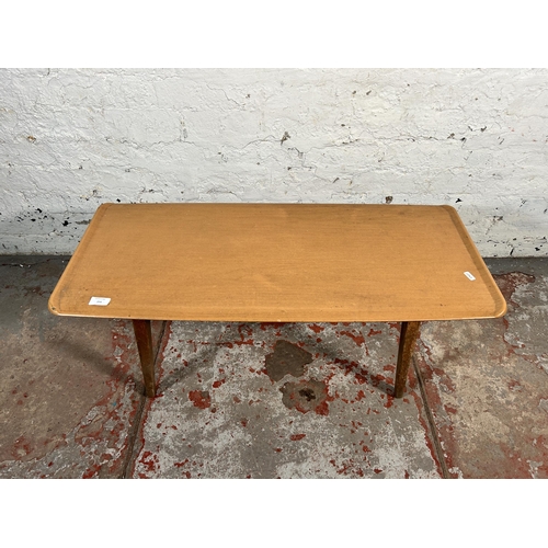 204 - A mid 20th century teak and melamine coffee table