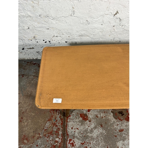 204 - A mid 20th century teak and melamine coffee table