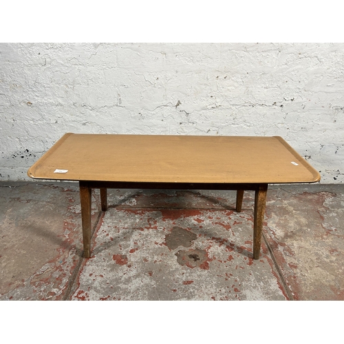 204 - A mid 20th century teak and melamine coffee table