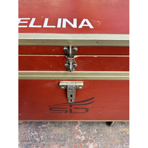 211 - A red painted and metal banded storage trunk on castors - approx. 92cm high x 101cm wide x 66cm deep