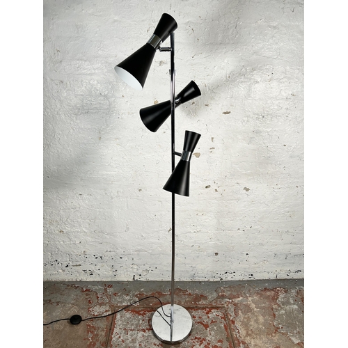 215 - A GoodHome black metal and chrome plated three light floor lamp - approx. 166cm high