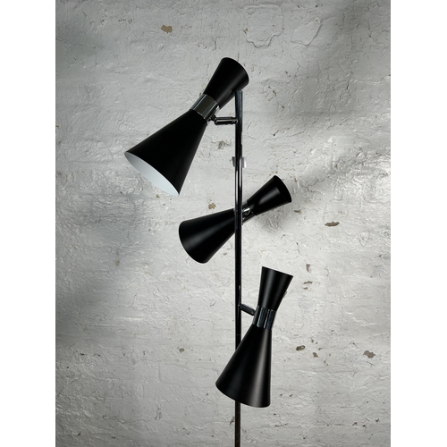 215 - A GoodHome black metal and chrome plated three light floor lamp - approx. 166cm high