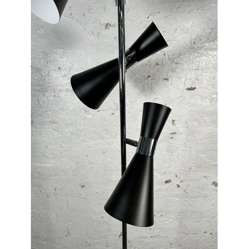 215 - A GoodHome black metal and chrome plated three light floor lamp - approx. 166cm high