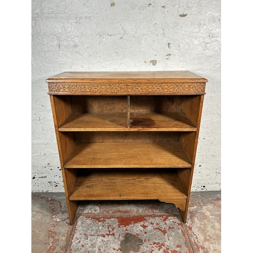 216 - An early 20th century carved oak bookcase - approx. 96cm high x 78cm wide x 30cm deep