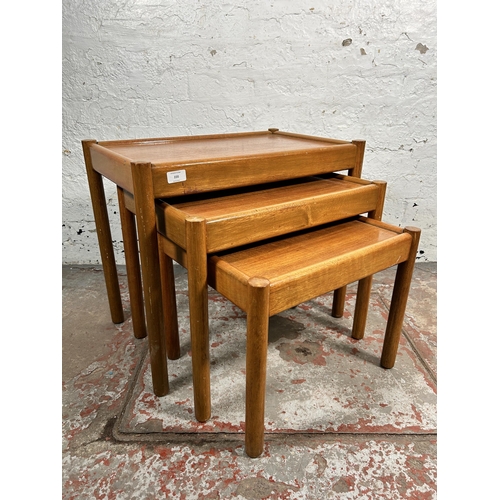 220 - A mid 20th century teak nest of tables - approx. 53cm high x 62cm wide x 39cm deep