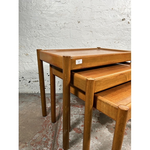 220 - A mid 20th century teak nest of tables - approx. 53cm high x 62cm wide x 39cm deep