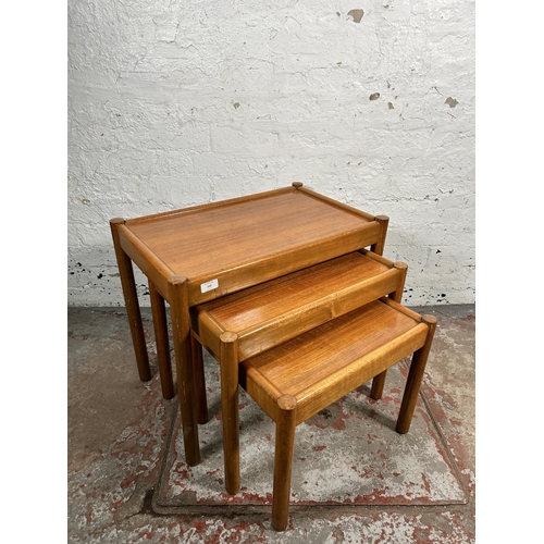 220 - A mid 20th century teak nest of tables - approx. 53cm high x 62cm wide x 39cm deep