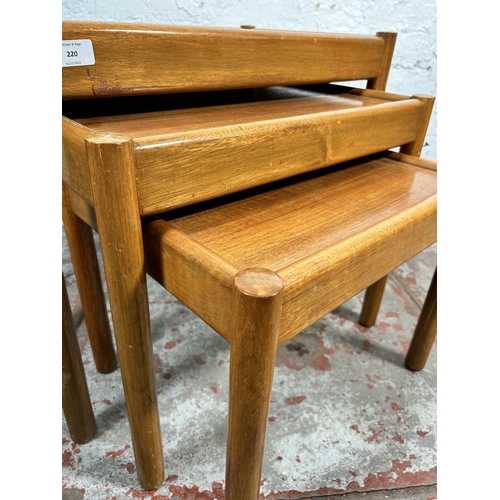 220 - A mid 20th century teak nest of tables - approx. 53cm high x 62cm wide x 39cm deep