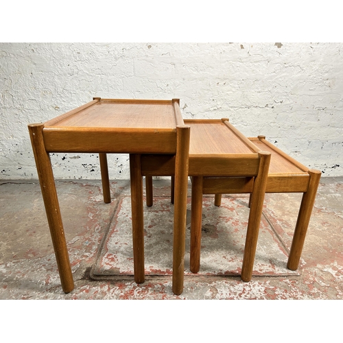 220 - A mid 20th century teak nest of tables - approx. 53cm high x 62cm wide x 39cm deep