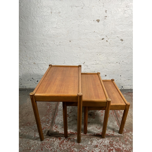 220 - A mid 20th century teak nest of tables - approx. 53cm high x 62cm wide x 39cm deep