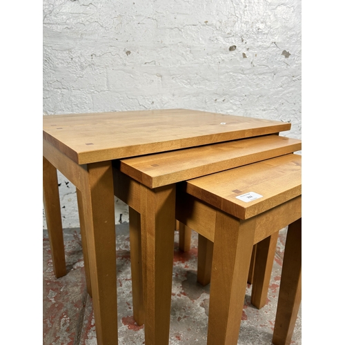 222 - A Next beech nest of tables - approx. 55cm high x 60cm wide x 50cm deep