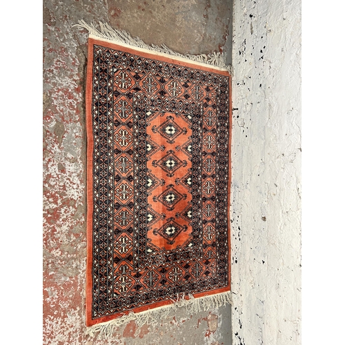 223 - A mid 20th century Afghan rug - approx. 126cm x 82cm