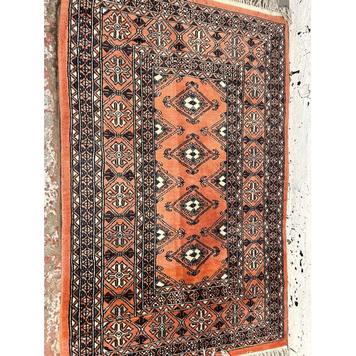 223 - A mid 20th century Afghan rug - approx. 126cm x 82cm