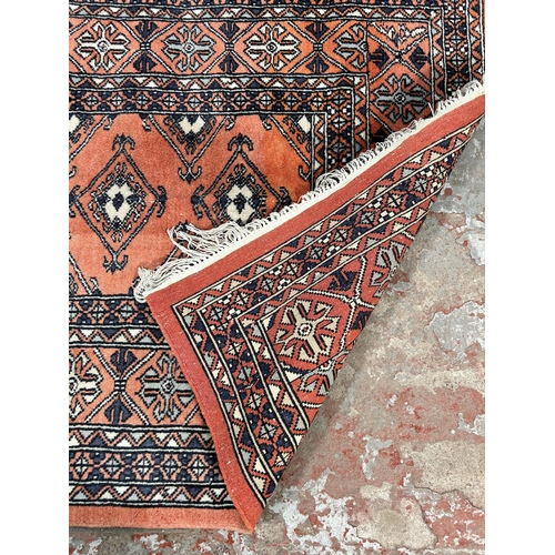 223 - A mid 20th century Afghan rug - approx. 126cm x 82cm