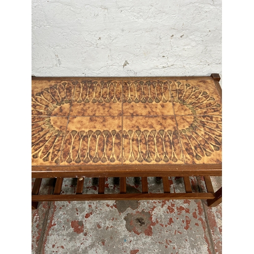 224 - A mid 20th century teak and tile top rectangular coffee table - approx. 41cm high x 47cm wide x 87cm... 