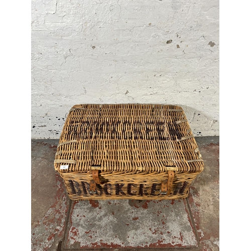 229 - A wicker basket - approx. 38cm high x 77cm wide x 54cm deep