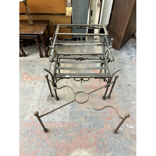 232 - Four blacksmith made wrought iron table bases - largest approx. 43cm high x 53cm wide x 102cm long