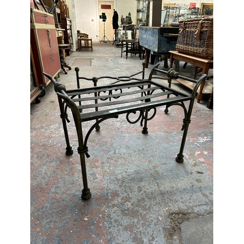 232 - Four blacksmith made wrought iron table bases - largest approx. 43cm high x 53cm wide x 102cm long