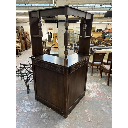 233 - A mid 20th century carved oak corner drinks bar - approx. 186cm high x 128cm wide x 98cm deep