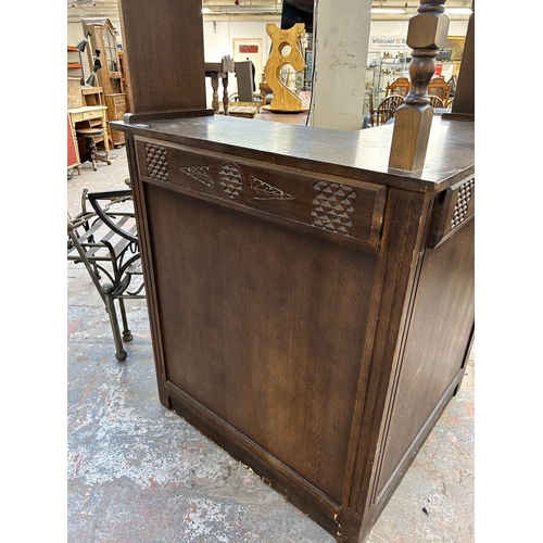 233 - A mid 20th century carved oak corner drinks bar - approx. 186cm high x 128cm wide x 98cm deep