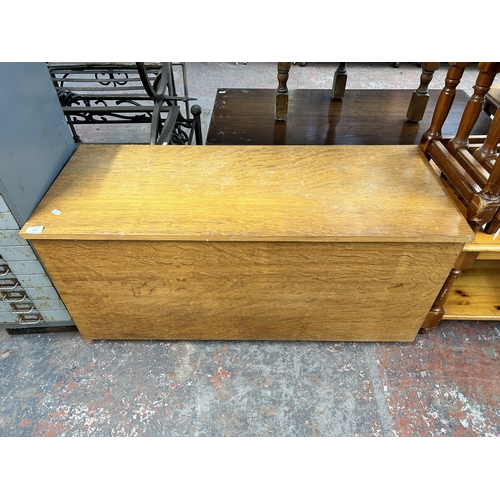 238 - A modern oak blanket box - approx. 50cm high x 107cm wide x 43cm deep