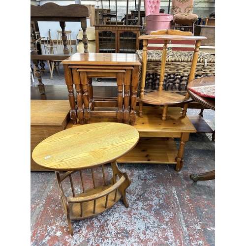 239 - Four pieces of occasional furniture to include pine corner side table, pine nest of tables, pine rec... 