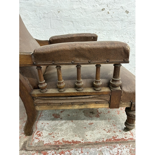 242 - A Victorian oak and brown vinyl upholstered parlour chair