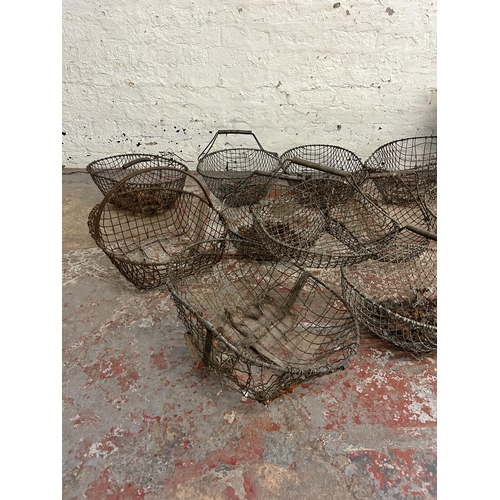 245 - Thirteen items, eleven vintage metal wire potato baskets, one galvanized bucket and one galvanized f... 