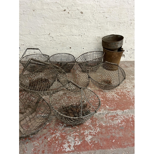 245 - Thirteen items, eleven vintage metal wire potato baskets, one galvanized bucket and one galvanized f... 