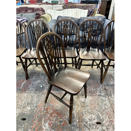 247 - Six beech wheel back dining chairs