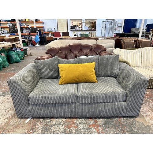 249 - A modern grey fabric upholstered three seater sofa - approx. 190cm wide