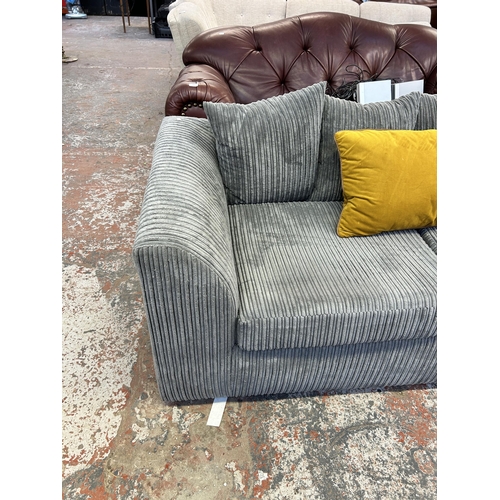 249 - A modern grey fabric upholstered three seater sofa - approx. 190cm wide