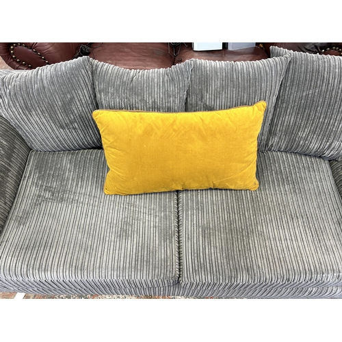 249 - A modern grey fabric upholstered three seater sofa - approx. 190cm wide