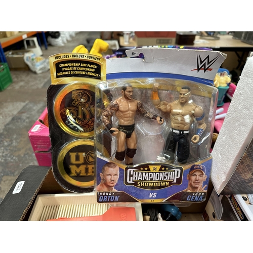 517 - A collection of action figurines to include boxed WWE Championship Showdown Randy Horton Vs John Cen... 