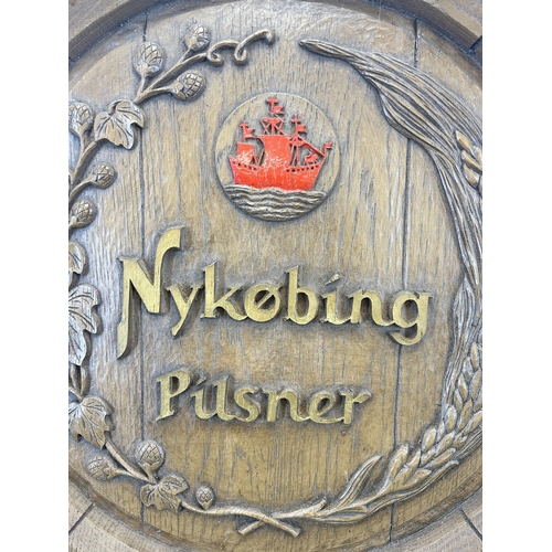 662 - A vintage Nykøbing Pilsner fibre glass barrel shaped advertising wall plaque - approx. 44cm in diame... 