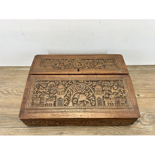 667 - An early 20th century Anglo Indian carved sandalwood desk tidy - approx. 9cm high x 32cm wide x 23cm... 