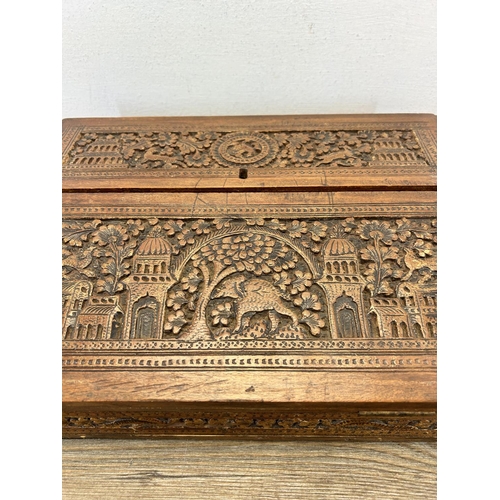 667 - An early 20th century Anglo Indian carved sandalwood desk tidy - approx. 9cm high x 32cm wide x 23cm... 