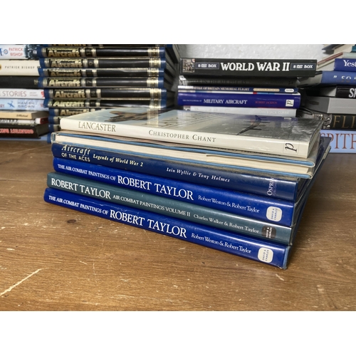 571 - A large collection of aviation and military related books