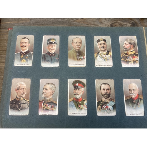 573 - Three vintage cigarette card albums containing a large collection of cigarette cards to include Will... 