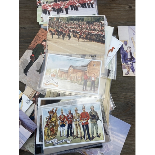 575 - A collection of vintage blank military postcards