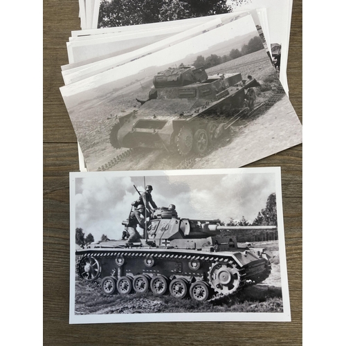 577 - A collection of black and white photographs of WWII German military vehicles